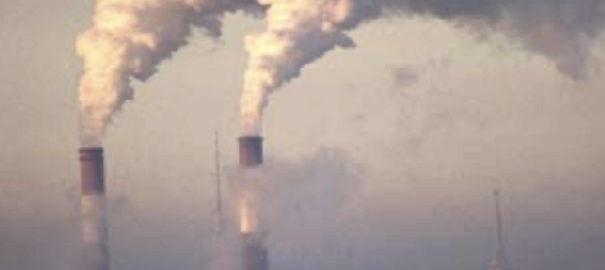 smoke stacks emitting water vapor