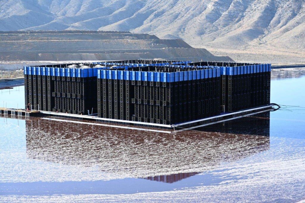 evaporative matrix in a pond, mountains in background