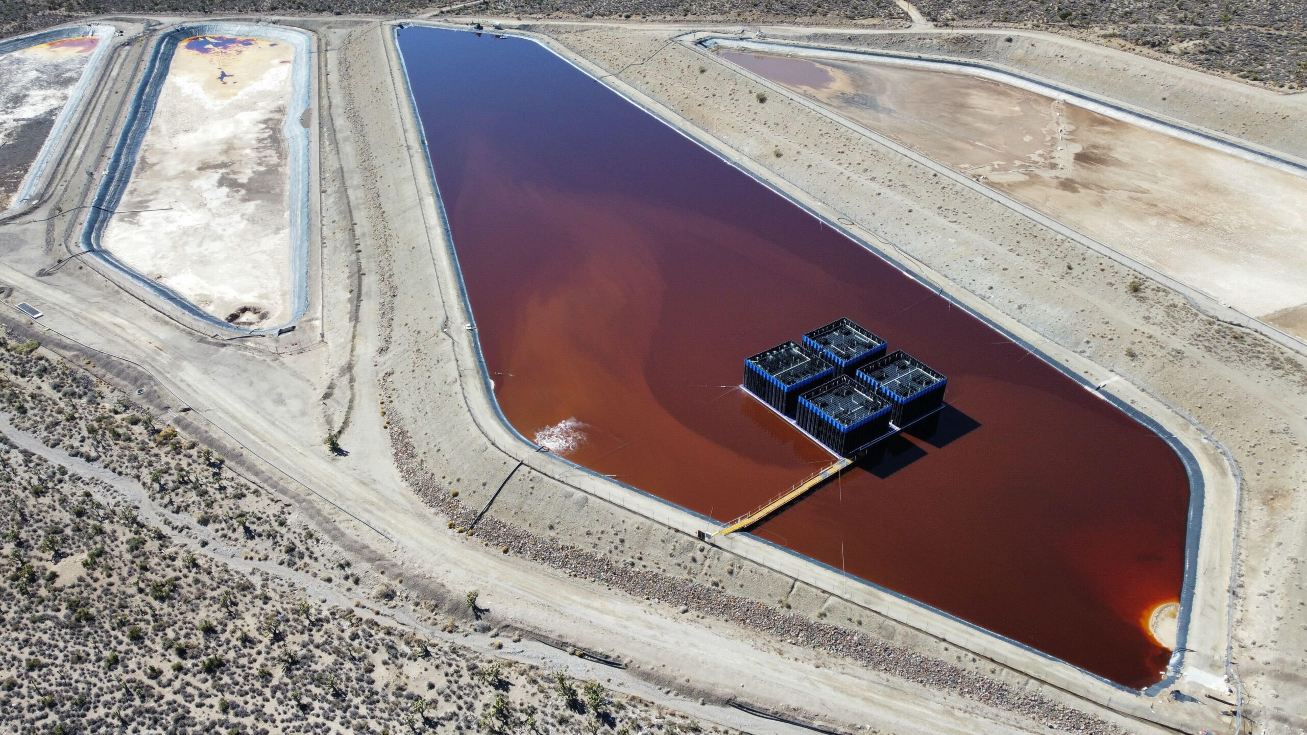 aerial view of evaporative matrix in pond at a metal mine site
