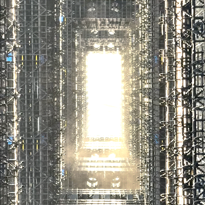 repeating gif of water trickling through the evaporative matrix and mist rising, sun is shining through the mist